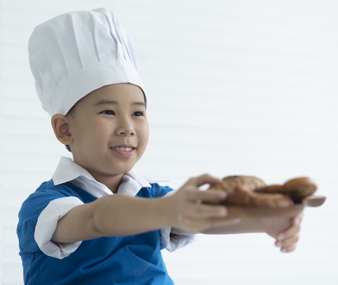 Child celebrating cultural diversity with food