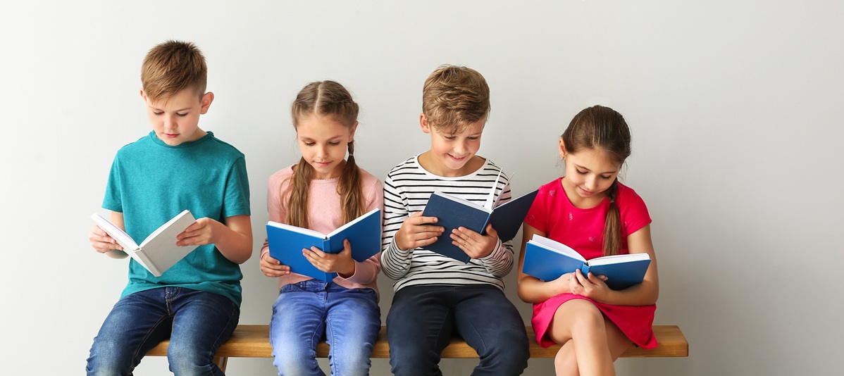 four children reading books